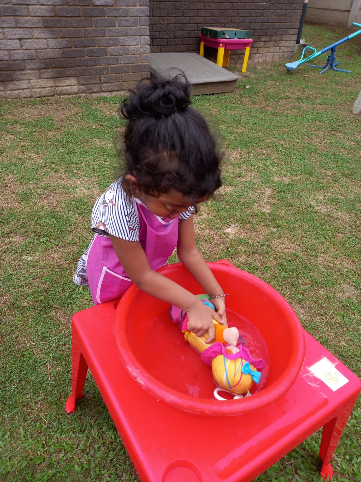 Child painting a rainbow